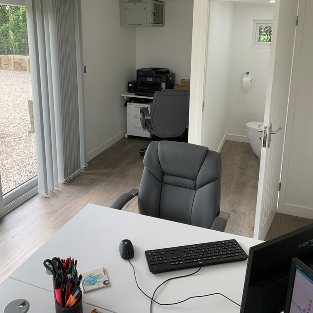 Garden office with room for 3 desks by AMC Garden Rooms